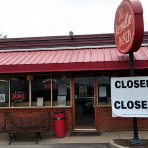 Exterior view of Sweet P's Downtown Dive with a closure sign.