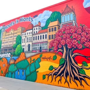 Vibrant mural at the Cal Johnson Recreation Center depicting historical elements of Cal Johnson's life and contributions.