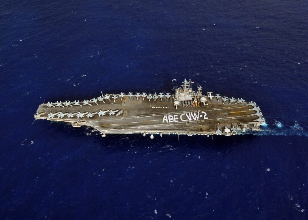 Sailors on an aircraft carrier flight deck