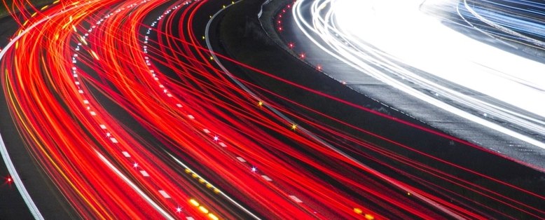 Tail-light trails on a highway at night